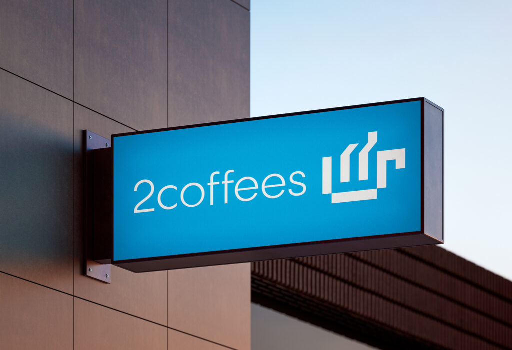 Cartel luminoso azul con texto "2coffees"